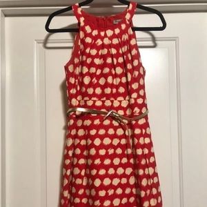 Orange with cream polka dot mock halter dress. A-line shape.